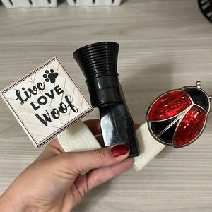 Three Bath & Body Works wallflower plugs